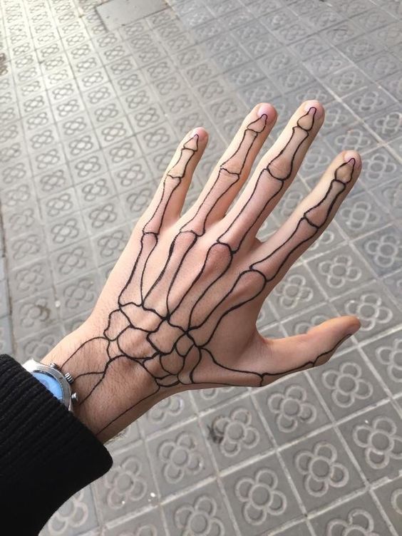 Simple Skeleton Hand Tattoo - skeleton hand tattoo meaning